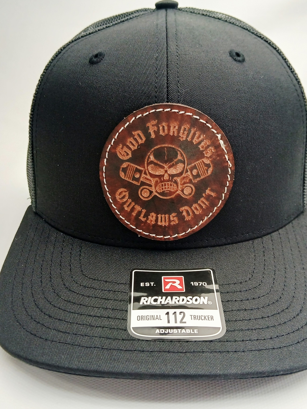 Richardson Black Trucker Hat with Brown Leather Patch - Outlaws Skull